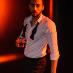 Exploring the tiny world bearded man in shirt holding glass of whiskey near 2023 11 27 04 51 47 utc